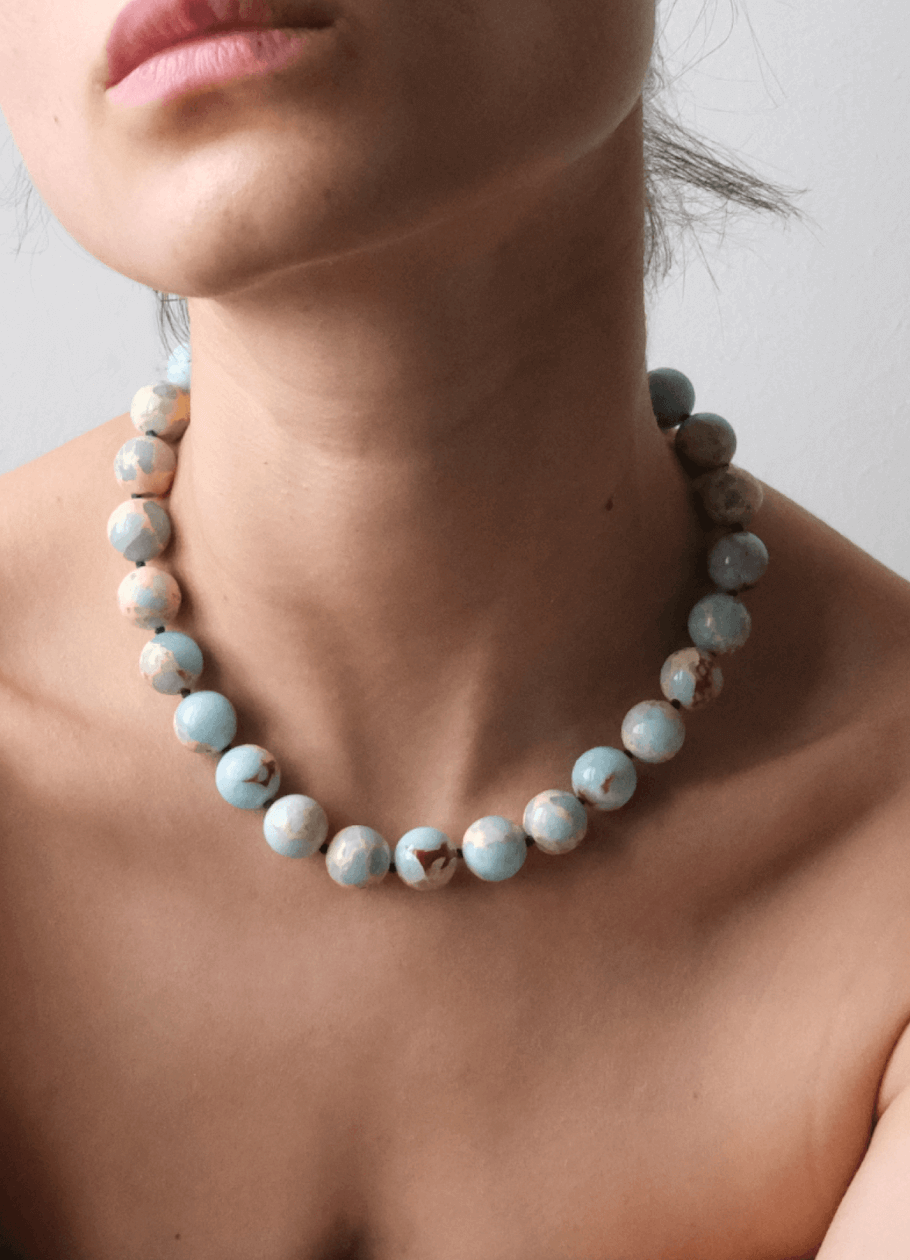 beautiful neckline Wearing a blue gemstone necklace imperial jasper